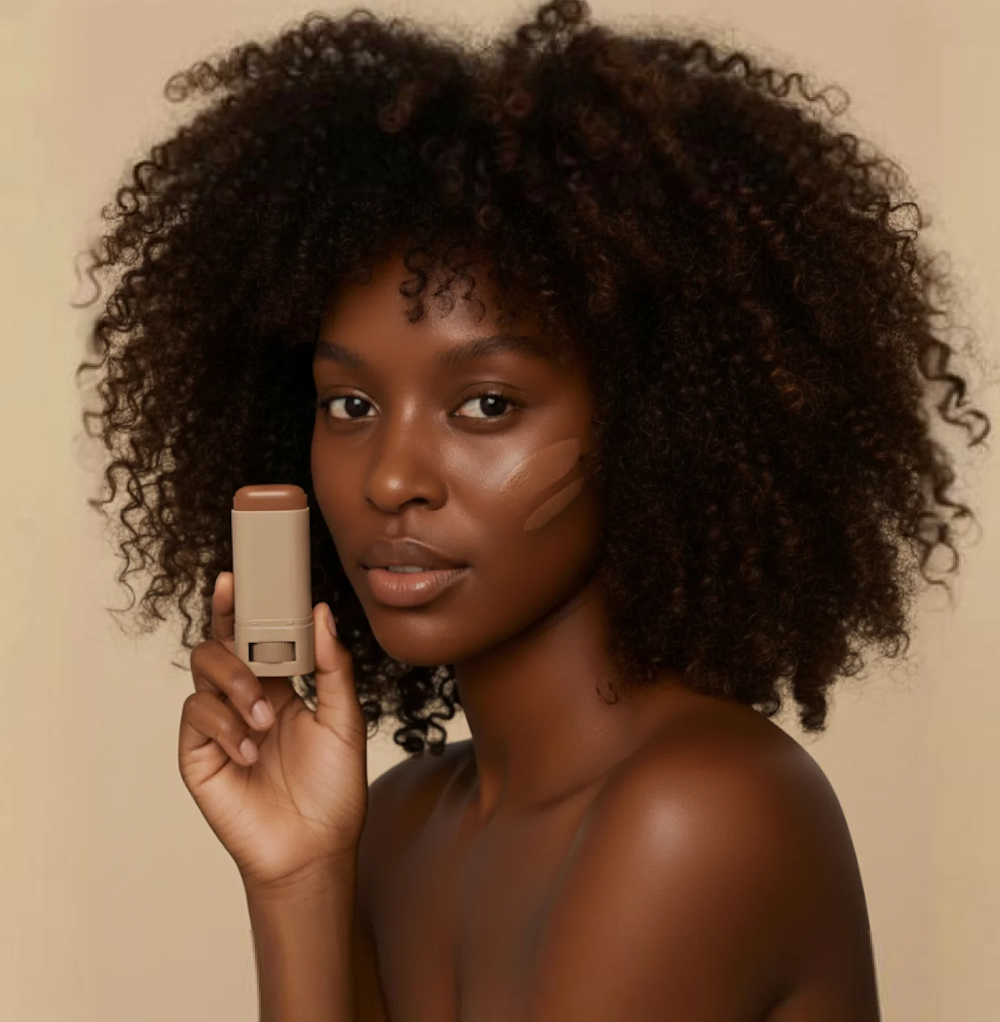 Woman holding NoMakeup Balm skin tint